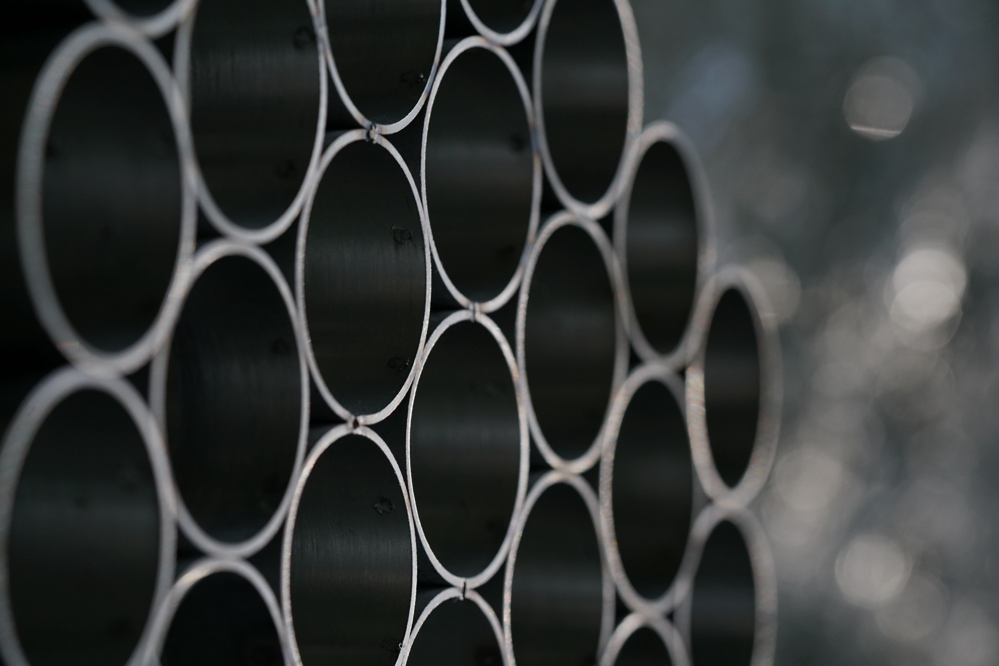 intersections — adjustable grid system of stainless steel sleeves
